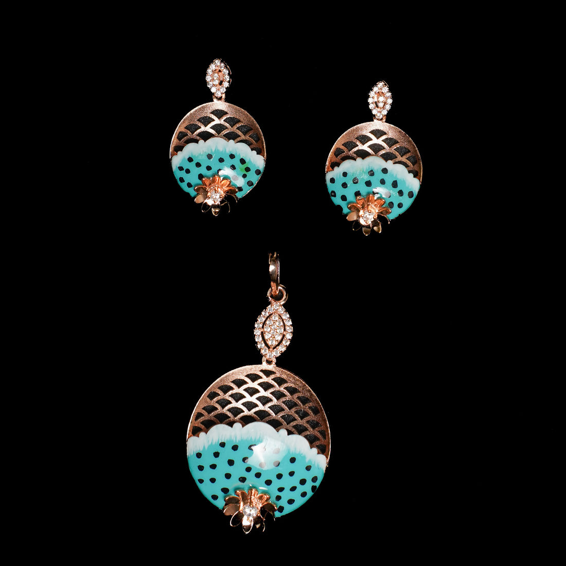Pair of earrings with turquoise and gold design on a black background